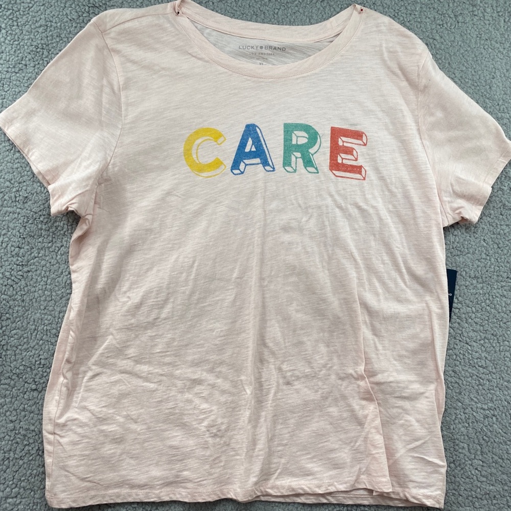 Lucky Brand Women Short Sleeve Tee Scoop Neck PullOver Light Pink ‘Care’ Logo XL